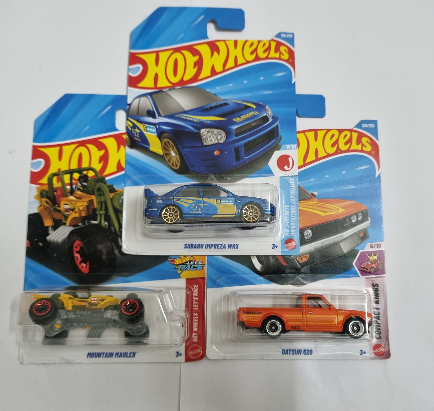 Hot Wheels J Case 2026 Combo Pack – Subaru Impreza WRX, Datsun 620 & Mountain Hauler