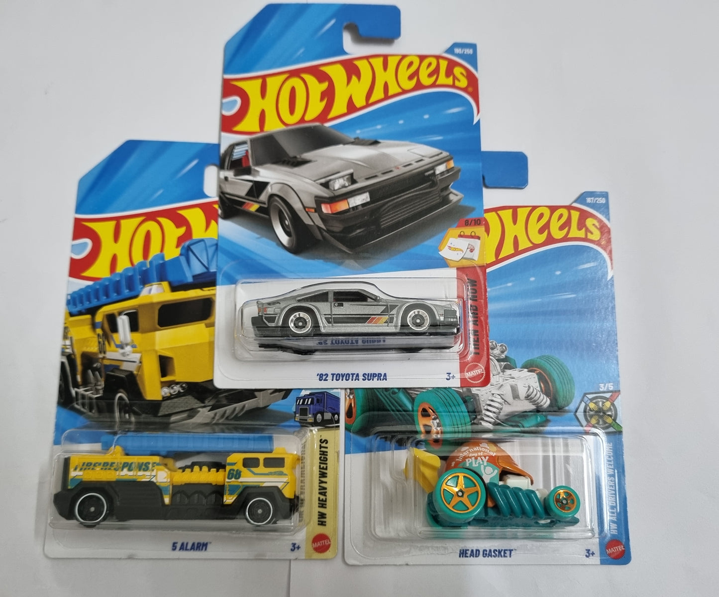 Hot Wheels J Case 2026 Combo Pack – ’82 Toyota Supra, 5 Alarm & Head Gasket