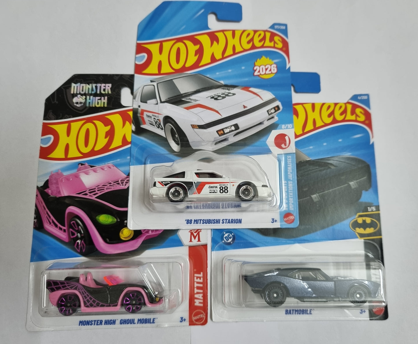 Hot Wheels J Case 2026 Combo Pack – ’88 Mitsubishi Starion, Batmobile & Monster High Ghoul Mobile