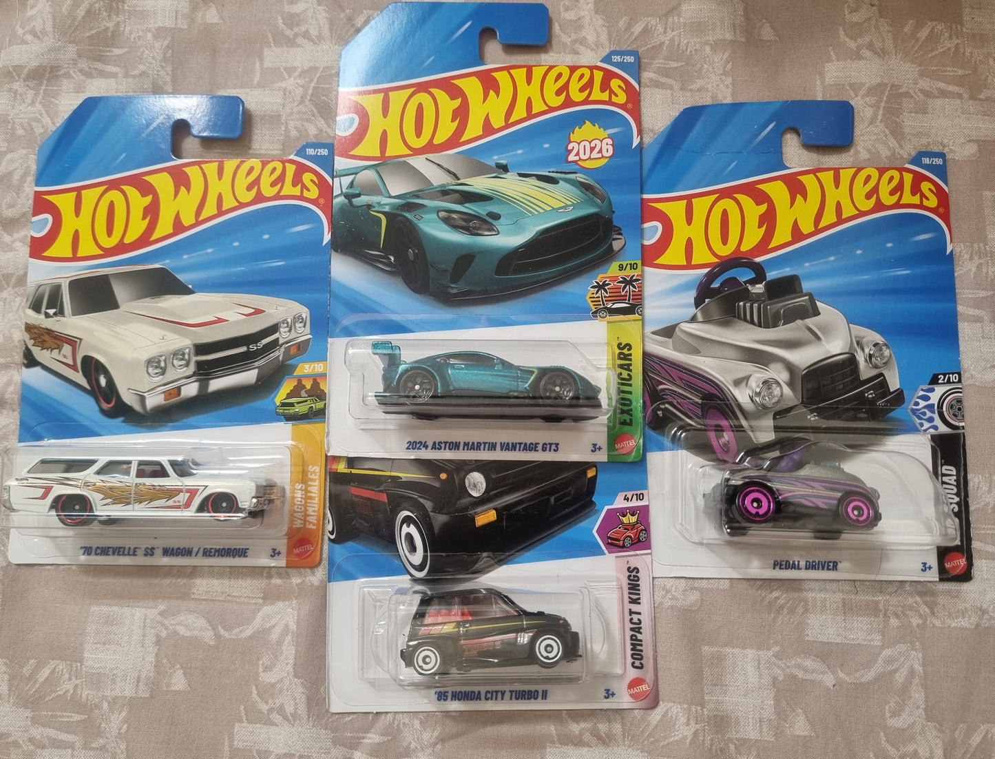 Hot Wheels 2026 F Case Imported Combo (SET-F4.2) – 2024 Aston Martin Vantage GT3, 85 Honda City Turbo II, 70 Chevelle SS Wagon/Remorque & Pedal Driver (Set of 4)