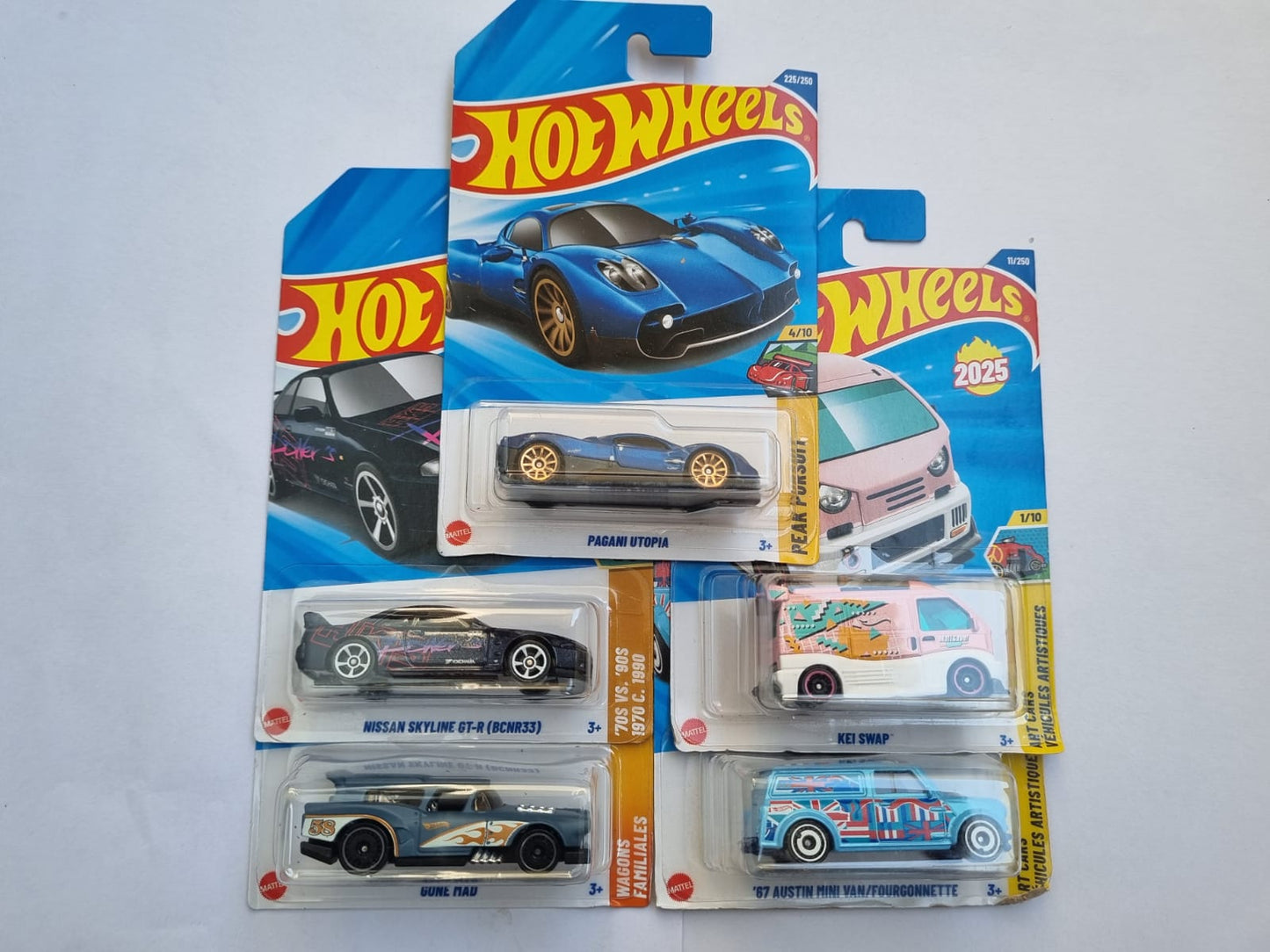 Hot Wheels 2025 Imported Combo Pack of 5 Die-Cast Cars – Pagani Utopia, Nissan Skyline GT-R R33, Bone Shaker, Kei Swap, ’67 Austin Mini Van Collectible Set